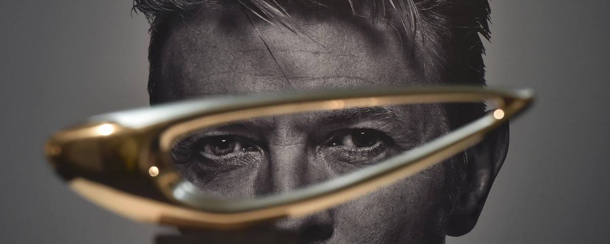 'Botallack' by Denis Mitchell, with an estimate of 7,000 GBP - 10,000 GBP, is seen in front of a portrait of British pop star David Bowie during a press view at Sotheby's auction house, in central London, Britain November 1, 2016. The auction house will stage a three-part sale entitled Bowie/Collector, which includes 350 works from Bowie' s private collection. REUTERS/Hannah McKay ORG XMIT: HMC02
