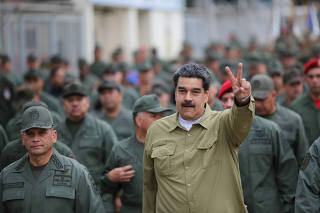 FILE PHOTO: Venezuela's President Nicolas Maduro gestures during a meeting with soldiers at a military base in Caracas