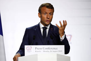 French President Emmanuel Macron attends a press conference during the G7 summit  in Biarritz