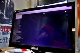 A man is reflected in a monitor as he takes part in a training session at Cybergym, a cyber-warfare training facility backed by the Israel Electric Corporation, at their training center in Hadera, Israel