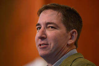 Author and journalist Glenn Greenwald speaks to the audience at Brazilian Press Association in Rio de Janeiro, Brazil