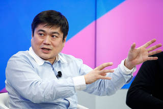 FILE PHOTO: Ito Director of the Media Lab of the Massachusetts Institute of Technology attends the annual meeting of the WEF in Davos
