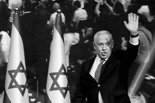 Israeli Prime Minister Benjamin Netanyahu arrives at the Likud party headquarters in Tel Aviv