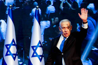 Israeli Prime Minister Benjamin Netanyahu arrives at the Likud party headquarters in Tel Aviv