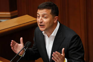 Ukrainian President Zelenskiy addresses lawmakers during a session of parliament in Kiev