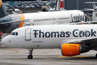 An Airbus A320 of Thomas Cook Airlines lands at Duesseldorf Airport