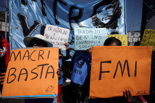 FILE PHOTO: People attend a demonstration against economic measures of Argentine President Mauricio Macri's government, in Buenos Aires