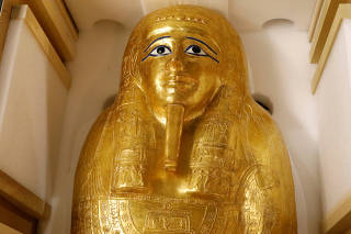 The Gold Coffin of Nedjemankh is displayed during a news conference to announce its return the the people of Egypt in New York City