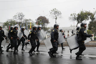 Police keep watch outside Congress after President Martin Vizcarra shut down Congress in Lima