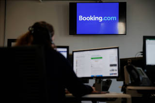 An employee works on his computer at the new Booking.com customers site in Tourcoing