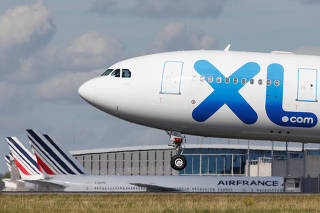 An XL Airways Airbus A330-200 airplane lands at the Charles-de-Gaulle airport in Roissy-en-France, near Paris