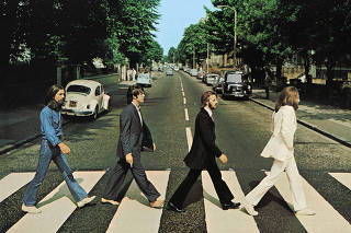 Members of the Beatles cross Abbey Road in London