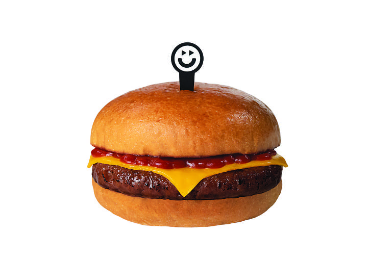 imagem mostra hamburguer, com pão, carne, queijo e molho de tomate