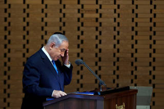 Israeli Prime Minister Benjamin Netanyahu gestures as he speaks during a memorial ceremony for Israeli soldiers killed in the 1973 Middle East War at Mount Herzl Military Cemetery in Jerusalem