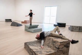 Emmanuel Tsao and Gareth Hogan perform in Jennifer Allora and Guillermo Calzadilla?s ?Fault Lines,? at the Museum of Modern Art in New York, Oct. 11, 2019. (Jeenah Moon/The New York Times)