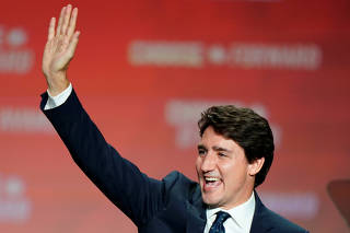 Liberal leader and Canadian Prime Minister Justin Trudeau waves on stage after the federal election at the Palais des Congres in Montreal