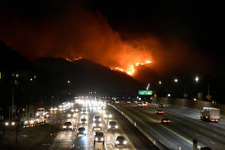 The Getty Fire burns next to the 405 freeway in the hills of West Los Angeles, California