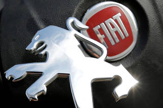Logos of Peugeot and Fiat are seen in this illustration picture