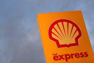 FILE PHOTO: The logo of Royal Dutch Shell is seen at a petrol station in Sint-Pieters-Leeuw