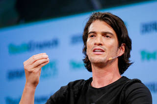 FILE PHOTO: Neumann, CEO of WeWork, speaks to guests during the TechCrunch Disrupt event in Manhattan, in New York City