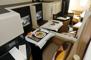 The new first class seats aboard an Etihad Airways Boeing 787 Dreamliner passenger jet are pictured during a media presentation at Zurich airport