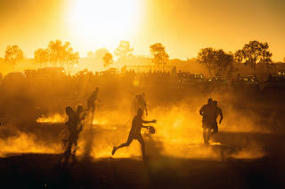 Indigenous players from across Australia?s Central Desert participate in the annual Yuendumu Football Carnival in Yuendumu, Australia, on Aug. 5, 2019. (Matthew Abbott/The New York Times)