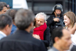 Former Brazilian President Luiz Inacio Lula da Silva is embraced after being released from prison, in Curitiba