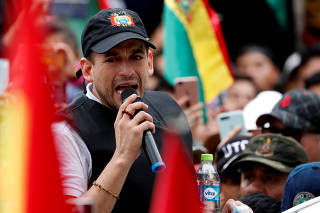 Santa Cruz civic leader and major opposition figure Camacho greets supporters in La Paz