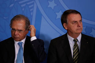 Brazil?s Economy Minster Guedes and Brazil's President Bolsonaro attend the launch of the Green and Yellow program at the Planalto Palace in Brasilia