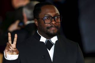 Singer songwriter Will.i.Am poses for photographers on the red carpet at the world premiere of the new James Bond 007 film 