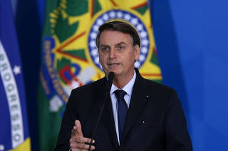 O presidente Jair Bolsonaro durante solenidade no Palácio do Planalto em comemoração do Dia do Servidor