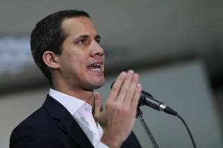 Venezuelan opposition leader Juan Guaido, who many nations have recognised as the country's rightful interim ruler, speaks during a news conference in Caracas