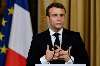 French President Emmanuel Macron gives a news conference after a meeting with NATO Secretary General Jens Stoltenberg at the Elysee palace in Paris