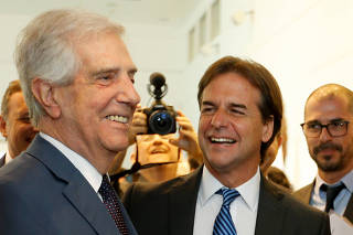 Uruguay's President-elect Luis Lacalle Pou meets with outgoing President Tabare Vazquez in Montevideo