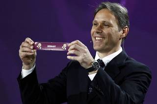 Former Dutch player van Basten draws Germany during the draw of the Euro 2012 soccer championship at the Palace of Arts in Kiev