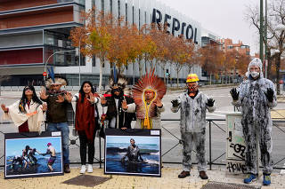 Indigenous and activists protest at Repsol headquarters as COP25 climate summit is held in Madrid