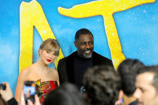 FILE PHOTO: Singer Taylor Swift and actor Idris Elba arrive for the world premiere of the movie 