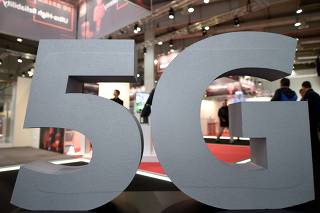 FILE PHOTO: A logo of the upcoming mobile standard 5G is pictured at the Hanover trade fair, in Hanover