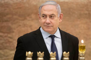 Israel's PM Netanyahu lights first candle of Hanukkah