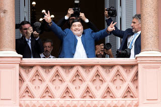 Argentinian soccer legend Diego Armando Maradona leaves after meeting Argentina's President Alberto Fernandez at the Casa Rosada Presidential Palace, in Buenos Aires