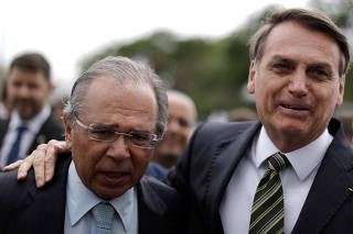 Brazil's President Jair Bolsonaro and Brazil's Economy Minister Paulo Guedes leave the Planalto Palace to deliver the economic reform package to National Congress, in Brasilia