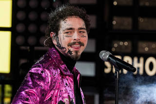 Post Malone performs during New Year's Eve celebrations in Times Square in the Manhattan borough of New York
