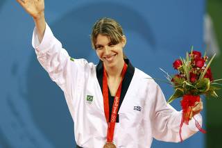 Bronze medallist Natalia Falavigna of Brazil poses during the medal ceremony of the women's +67kg taekwondo competition at the Beijing 2008 Olympic Games