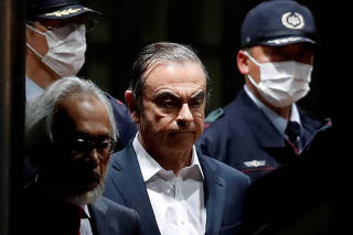 FILE PHOTO: Former Nissan Motor Chairman Carlos Ghosn leaves the Tokyo Detention House in April