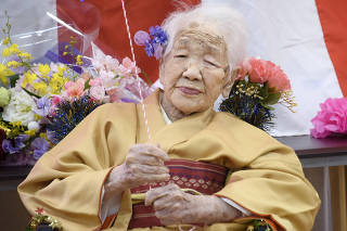 Kane Tanaka, born in 1903, smiles as a nursing home celebrates three days after her 117th birthday in Fukuoka