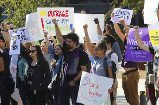 Google employees participate in a walkout at Google's headquarters in Mountain View, Calif.