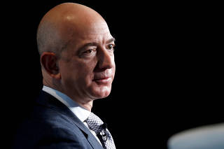 FILE PHOTO: Jeff Bezos, founder of Blue Origin and CEO of Amazon, speaks about the future plans of Blue Origin in Washington