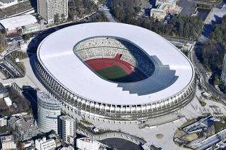 An aerial view shows the new National Stadium, the main stadium of Tokyo 2020 Olympics and Paralympics, in Tokyo