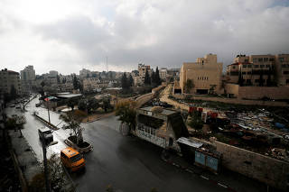 FILE PHOTO: An abandoned Palestinian parliament building is seen in a general view picture of the Palestinian town of Abu Dis in the Israeli-occupied West Bank, east of Jerusalem