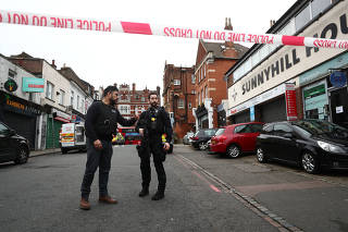 Police is seen near a site where a man was shot by armed officers in Streatham